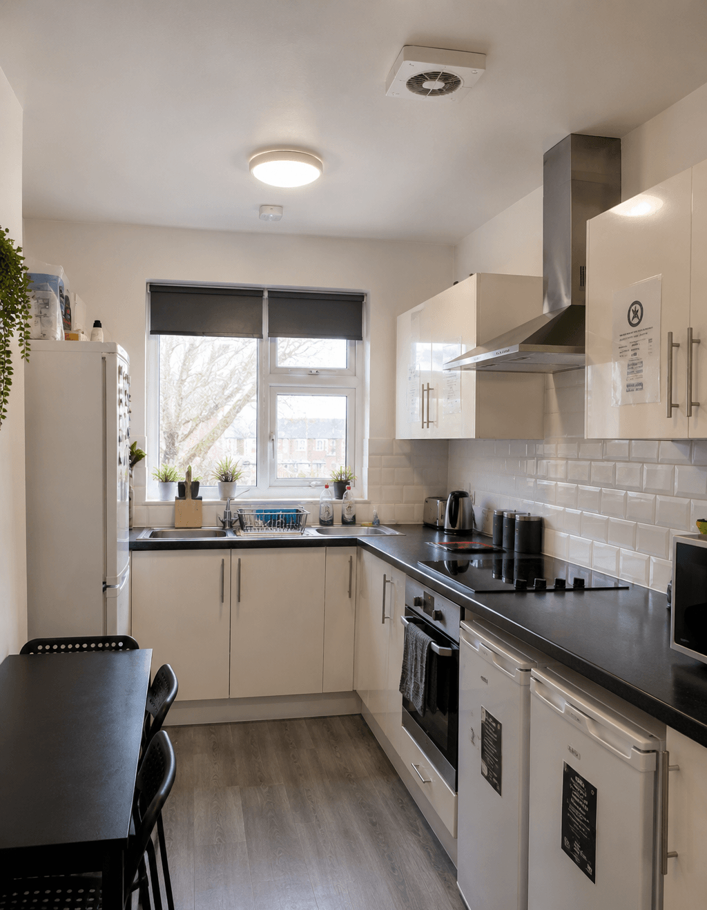 Shared HMO kitchen with mechanical ventilation and extractor system for Ealing HMO compliance.